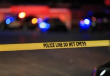 Erika Kirk Traumatized Again After Second Shooting crime scene, police tape, police line, investigation, law enforcement, emergency lights, police vehicle, night scene