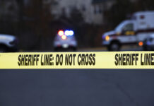 Nancy Guthrie’s Children Issue an Emotional Statement crime scene, sheriff line, police tape, do not cross, law enforcement, emergency vehicles, police car, ambulance, investigation