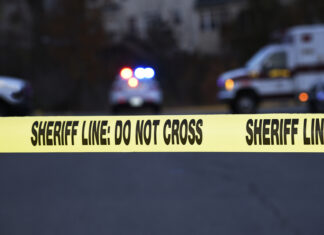 Nancy Guthrie’s Children Issue an Emotional Statement crime scene, sheriff line, police tape, do not cross, law enforcement, emergency vehicles, police car, ambulance, investigation