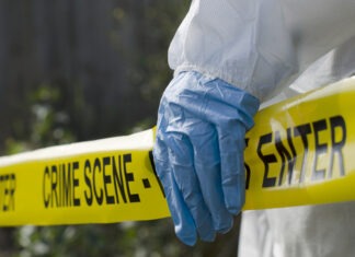 Missing 10-Year Old Girl Discovered Dead crime scene, police tape, investigation, forensic investigator, blue gloves, protective suit, law enforcement, evidence collection