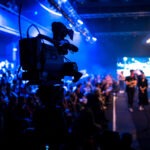 Beloved TV Star Dead at 66 fashion show, runway, event production, camera operator, videographer, stage lighting, audience, models