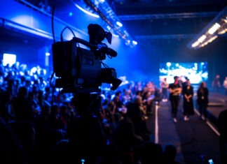 Beloved TV Star Dead at 66 fashion show, runway, event production, camera operator, videographer, stage lighting, audience, models