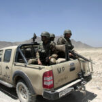 9 Police Officers Killed in Shooting military police, MP, armed forces, desert patrol, soldiers, helmets, pickup truck, Afghanistan, security patrol, mountains