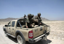 9 Police Officers Killed in Shooting military police, MP, armed forces, desert patrol, soldiers, helmets, pickup truck, Afghanistan, security patrol, mountains