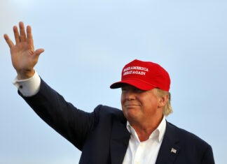 Trump’s Wild 1,800 Pardon Spree Stuns Nation Donald Trump, president, rally, MAGA hat, Make America Great Again, campaign, political event, Republican