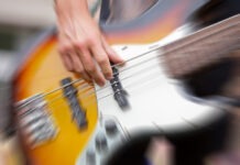 Beloved Musician is Dead at 50 bass guitar, musician, playing bass, performance, strings, live music, guitarist