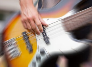 Beloved Musician is Dead at 50 bass guitar, musician, playing bass, performance, strings, live music, guitarist