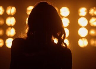 Legendary Singer Dies at 80 concert, stage lights, performance, silhouette, performer, stage, music venue, entertainment