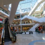 Mass Shooting in Mall: 2 Dead, 3 Hurt shopping mall, retail center, escalator, multiple floors, atrium, skylight, commercial building, interior space