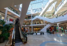 Mass Shooting in Mall: 2 Dead, 3 Hurt shopping mall, retail center, escalator, multiple floors, atrium, skylight, commercial building, interior space