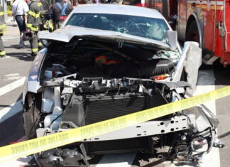 Beloved Reporter Killed in Freak Accident car crash, accident scene, vehicle wreck, firefighters, fire truck, police tape, emergency response, damaged car, crash site