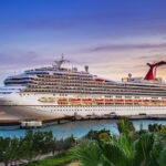Cruise Passenger Drowns While Snorkeling Carnival cruise ship, cruise line, port, docked ship, passenger ship, tropical destination, sunset, pier
