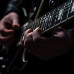 Rock Guitar Legend Dead at 72 guitarist, electric guitar, musician, performance, music, live music, guitarist hands, fretboard