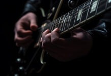 Rock Guitar Legend Dead at 72 guitarist, electric guitar, musician, performance, music, live music, guitarist hands, fretboard