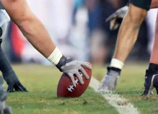 Beloved Football Star Dies by Suicide at 40 Football Game Line of Scrimmage